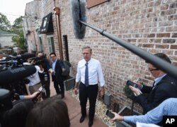 FILE - Republican presidential candidate, former Florida governor Jeb Bush, speaks to the media during a campaign stop, Nov. 17, 2015, in Florence, South Carolina.