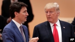ap Canada's Prime Minister Justin Trudeau, left, talks to U.S. President Donald Trump