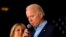 FILE - Democratic presidential candidate and former Vice President Joe Biden is accompanied by his wife Dr. Jill Biden as he addresses supporters at a rally at the Drake University Olmsted Center in Des Moines, Iowa, Feb. 3, 2020. 