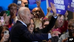 FILE - Democratic presidential nominee Vice President Kamala Harris, right, campaigns with President Joe Biden at the IBEW Local Union #5 union hall in Pittsburgh, Pennsylvania, Sept. 2, 2024. 