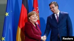 German Chancellor Angela Merkel and Serbian Prime Minister Aleksandar Vucic shake hands before their talks at the Chancellery in Berlin, Germany, March 14, 2017. 