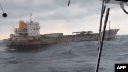 This picture taken by Taiwan’s coast guard on Jan. 3, 2025 shows the "Shunxing 39" cargo ship at sea. Taiwanese authorities are investigating the ship suspected of damaging a subsea telecoms cable northeast of the island. (Photo by Handout / TAIWAN COAST GUARD / AFP) 