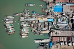 FILE - This aerial photo taken on April 27, 2020, shows fishing boats at a port in Lianyungang, in China's eastern Jiangsu province.