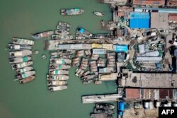 FILE - This aerial photo taken on April 27, 2020, shows fishing boats at a port in Lianyungang, in China's eastern Jiangsu province.