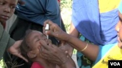 A child receives the polio vaccine in Somalia. 