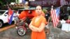 Anida Yoeu Ali with her Studio Revolt crew in production for The Buddhist Bug series. Here she stands in front of Java Cafe and Gallery in Phnom Penh, Cambodia, June 25, 2015. (Courtesy photo/Masahiro Sugano)