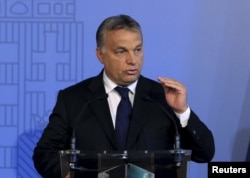 FILE - Hungarian Prime Minister Viktor Orban delivers a speech in Budapest, Hungary, Sept. 7, 2015.