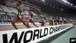 Ethiopia's Gbre-gziabher Gebrmariam, left, leads ahead of Eritrea's Zerenay Tadese, 2nd left, and Ethiopia's Kenenisa Bekele during Men's 10,000 meters race at the World Athletics Championships in Osaka, Japan, August 27, 2007.