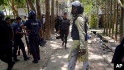 Bangladeshi policemen arrive near the scene of a blast in Kishoreganj, about 90 kilometers (60 miles) north of the capital of Dhaka, Bangladesh, July 7, 2016.