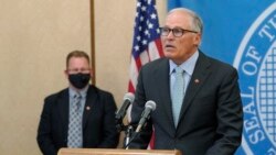 Washington Gov. Jay Inslee, right, speaks at a news conference, Aug. 18, 2021, at the Capitol in Olympia.