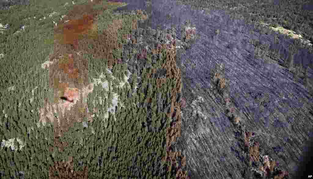 Fire damage is viewed from a Colorado National Guard Blackhawk helicopter after four days battling the blaze, outside Nederland, Colorado.