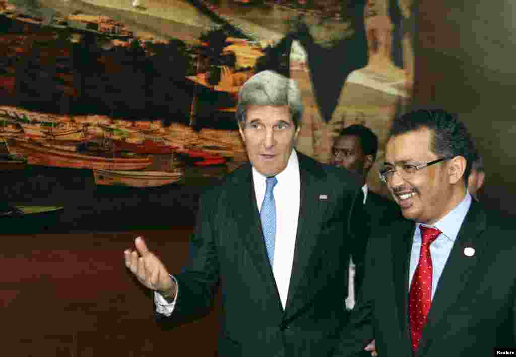 U.S. Secretary of State John Kerry (L) and Ethiopian Foreign Minister Tedros Adhanom in discussion after holding a news conference in Addis Ababa May 25, 2013, at which Kerry said he will soon name a new envoy for the Sudans.