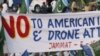 Pakistanis, Angered by US Drone Strikes, Block NATO Supply Route