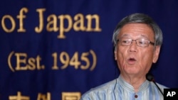 FILE - Okinawa Gov. Takeshi Onaga speaks at the Foreign Correspondents' Club of Japan in Tokyo, May 20, 2015. Onaga, who died of cancer Wednesday, had spearheaded said opposition to the base.