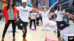 Tao Porchon-Lynch teaches yoga to hundreds in Times Square, NYC in 2013. At the time this photo was taken she was 94 years young. (Brian Ach/AP Images)