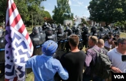 Alt Right demonstrators class with counter demonstrators at the entrance to Lee Park in Charlottesville, Va., Saturday, Aug. 12, 2017.