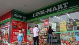 People visit a supermarket in Hanoi, Vietnam, Thursday, Feb. 21, 2019. (AP Photo/Minh Hoang)