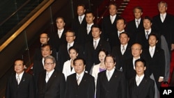 Japan's new Prime Minister Yoshihiko Noda, front row center, and some of his Cabinet members stand together during an official photo session following their first Cabinet meeting at the prime minister's official residence in Tokyo, September 2, 2011.
