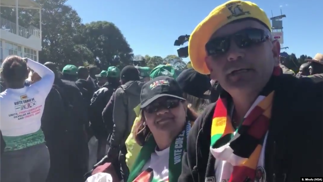 Some of the Zimbabweans following proceedings at the Zanu PF's "white interface rally," July 21, 2018, in Harare where President Emmerson Mnangagwa was speaking.