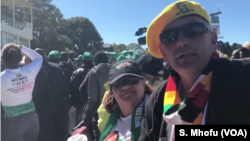 Some of the Zimbabweans following proceedings at the Zanu PF's "white interface rally," July 21, 2018, in Harare where President Emmerson Mnangagwa was speaking.