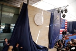 U.S. President Donald Trump's daughter Ivanka Trump, left, and U.S. Treasury Secretary Steve Mnuchin unveil an inauguration plaque during the opening ceremony of the new US embassy in Jerusalem, May 14, 2018.