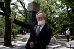 Lee Jong-keun, an atomic bomb survivor, speaks after a memorial service for Korean atomic bomb victims in front of Monument to Korean Victims and Survivors at Hiroshima Peace Memorial Park in Hiroshima, western Japan Wednesday, Aug. 5, 2020. (AP Photo)