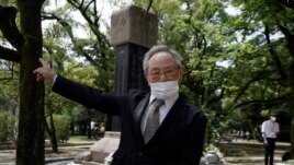 Lee Jong-keun, an atomic bomb survivor, speaks after a memorial service for Korean atomic bomb victims in front of Monument to Korean Victims and Survivors at Hiroshima Peace Memorial Park in Hiroshima, western Japan Wednesday, Aug. 5, 2020. (AP Photo)