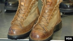 VOA correspondent Steve Herman's boots, before recrafting, after nearly a quarter century of wear. (Steve Herman/VOA) 