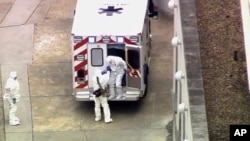 An ambulance arrives with Ebola victim Dr. Kent Brantly at Emory University Hospital on Aug. 2, 2014.