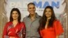 FILE - Bollywood actor Akshay Kumar, center, with his wife Twinkle Khanna, left, and actress Radhika Apte pose for the media during the song launch of their film "Padman" in Mumbai, India, Dec. 20, 2017.