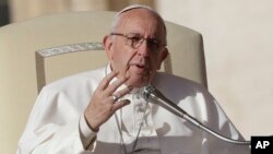 FILE - Pope Francis speaks during his weekly general audience in St. Peter square at the Vatican, Nov. 22, 2017.