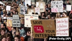 People protest against the copyright bill in Leipzig, Germany.