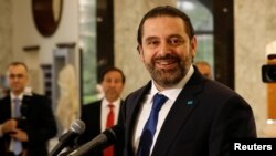 FILE - Lebanon's Prime Minister-designate Saad al-Hariri reacts at the presidential palace in Baabda, Lebanon, May 24, 2018. 