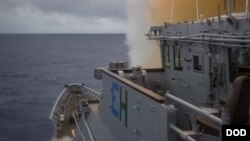 FILE - The Ticonderoga-class guided-missile cruiser USS Chancellorsville (CG 62) launched a Standard Missile (SM) 2 during a missile exercise (MSLEX) in the Philippine Sea.