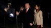 Presiden Amerika Serikat Donald Trump bersama Ibu Negara AS Melania Trump dan putra mereka Barron Trump, melambaikan tangan setibanya di Gedung Putih, Washington DC, 1 Januari 2017, sekembalinya dari liburan akhir tahun di Mar-a-Lago estate, Palm Beach, Florida.