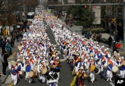 South Koreans dressed in their traditional "Hanbok" attire march during a rally to mark the centennial of the March First Independence Movement Day against Japanese colonial rule (1910-45), in Seoul, South Korea, March 1, 2019.