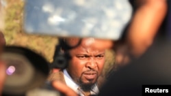 FILE - Agency Gumbo, a lawyer representing Zimbabwe's main opposition party Citizen Coalition for Change (CCC), speaks to the press, in Bindura, Zimbabwe, July 9,2023.