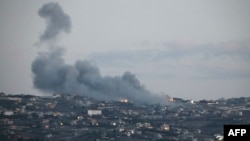 Smoke billows from the site of an Israeli strike on the southern Lebanese village of Taybeh on Sept. 16, 2024, amid ongoing cross-border clashes between Israeli troops and Lebanon's Hezbollah fighters.