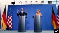 U.S. President Barack Obama and German Chancellor Angela Merkel address media, Berlin, June 19, 2013.