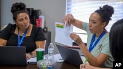 Social idiosyncratic    Mary Schmauss, left, and attendance clerk Katrice Grant sermon   truancy cases they request   to tackle, astatine  Algodones Elementary School successful  Algodones, New Mexico, Oct. 1, 2024.