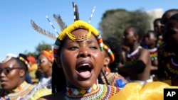 FILE: A woman wears traditional headgear and necklace, during King Misuzulu ka Zwelithini coronation, at KwaKhangelamankengane Royal Palace in Nongoma, South Africa. Taken 8.20.2022