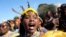 FILE: A woman wears traditional headgear and necklace, during King Misuzulu ka Zwelithini coronation, at KwaKhangelamankengane Royal Palace in Nongoma, South Africa. Taken 8.20.2022