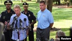 Boston Mayor Marty Walsh (R) holds a news conference with William Evans, Boston Police commissioner, in the Boston Commons in Boston, Massachusetts, Aug. 19, 2017.