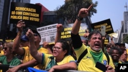 Demonstrators take part in a protest calling for the impeachment of Supreme Court Minister Alexandre de Moraes, who recently imposed a nationwide block on Elon Musk’s social media platform X, in Sao Paulo, Saturday, Sept. 7, 2024.