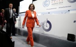 U.S. House Speaker Nancy Pelosi of California arrives for a press conference at the COP25 climate talks summit in Madrid, Dec. 2, 2019.