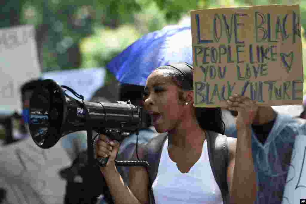 Demonstrators protest across the street from a Confederate memorabilia store in Kennesaw, Georgia, USA.&nbsp; Protests continued following the death of George Floyd, who died on May 25 after being restrained by Minneapolis police officers.&nbsp;(AP Photo/Mike Stewart)