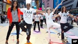 Pfizer's Get Old Initiative. Tao Porchon-Lynch teaches yoga to hundreds in Times Square, NYC. (Brian Ach/AP Images forPfizer)