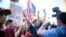 Pro Trump supporters face off with peace activists during protests outside a Donald Trump campaign rally in Phoenix, Ariz., Aug. 22, 2017.