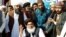 FILE - Khadim Hussain Rizvi, center, leader of the Tehreek-e-Labbaik Pakistan Islamist political party, gestures at a protest site at Faizabad junction in Islamabad, Pakistan, Nov. 27, 2017.