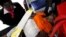 Paramedics assist a woman injured during a security exercise Nov. 30, 2015, at Strathmore University in Kenya's capital Nairobi.